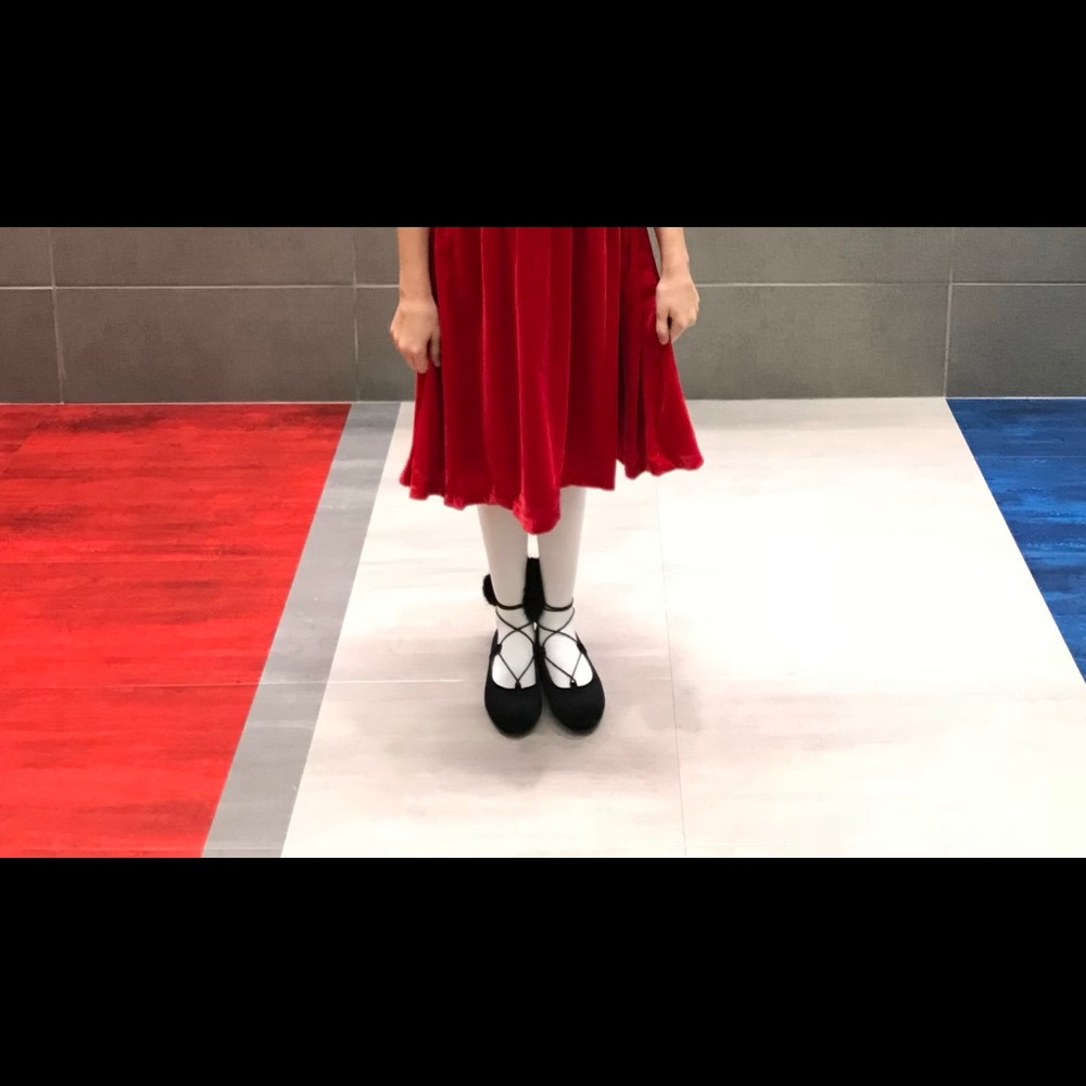 Girls black ballet-style dress pom pom shoe